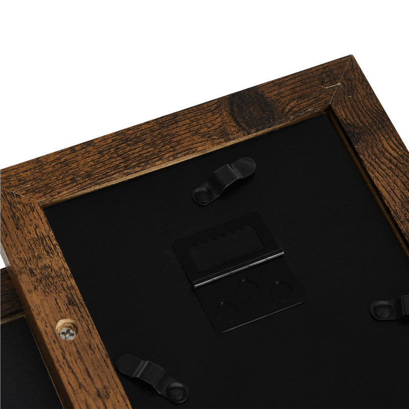 Close up of the frame back showing the clips that hold each print in place