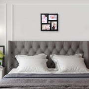 Black collage picture frame mounted above a grey upholstered bed headboard