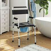 Commode chair placed beside the bath in a modern bathroom