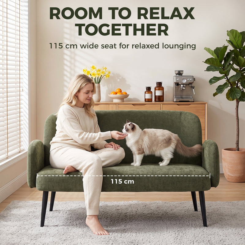 Woman and cat on the green sofa with the 115 cm wide seat marked