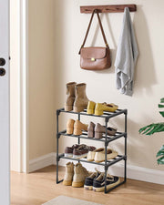 Shoe rack in a hallway entryway holding boots, flats and trainers under a wall hook rail