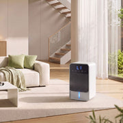HOMCOM dehumidifier lifestyle shot in a bright living room beside a sofa