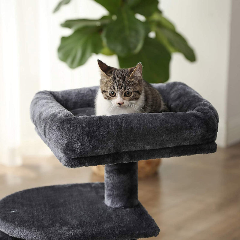 Cat tree positioned in a small room to show its compact footprint