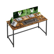 Rustic brown Vasagle computer desk with a black steel frame, studio view