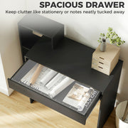 Open desk drawer holding paper and stationery