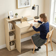 Student writing at the natural desk with a lamp, books and baskets on the shelves