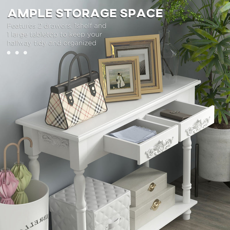 Close-up of an open drawer holding a bag, photo frames and accessories on the console table