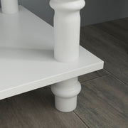 Close-up of the console table's turned wooden leg and floor-level foot