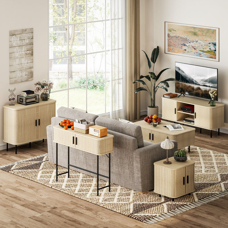 Console table behind a grey sofa in a bright living room