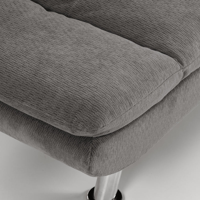 Close-up of grey cushion edge and chrome steel leg