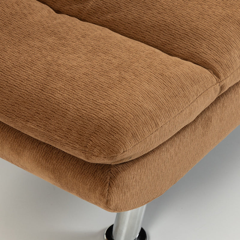 Close-up of brown cushion edge and chrome steel leg