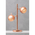 Copper twin light table lamp with two round shades in a room