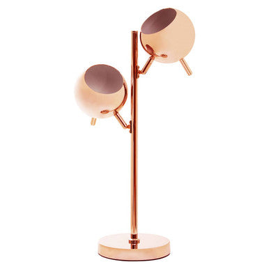 Side view of copper twin round shade table lamp