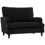 Studio view of the wide corduroy armchair showing its turned legs