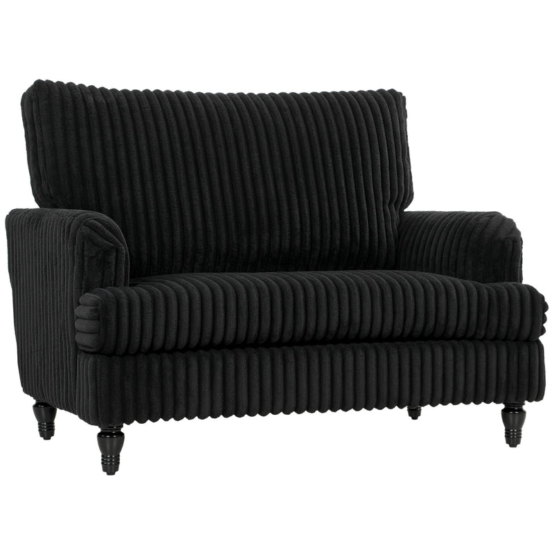 Studio view of the wide corduroy armchair showing its turned legs