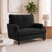 Living room scene with the armchair, a round side table and a fiddle leaf fig