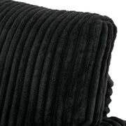 Angled close-up of the rolled armrest and back cushion