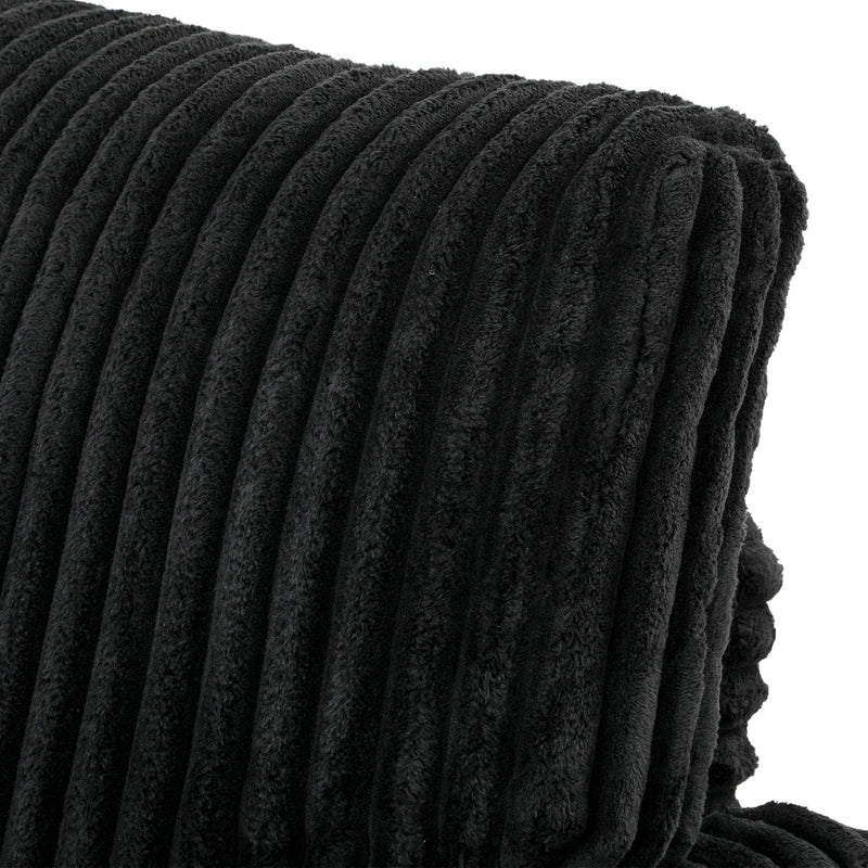 Angled close-up of the rolled armrest and back cushion