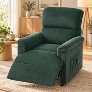 Green recliner with the footrest raised beside a lamp and side table