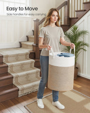 Child lifting the laundry basket by its extended handles