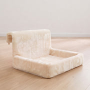 Cream cat bed standing on a wooden floor showing its hanging hooks