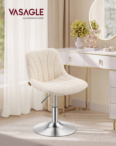 Cream white dressing stool placed at a vanity table with a round mirror