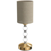 Crystal bedside lamp with a drum shade and three faceted crystal accents, studio shot