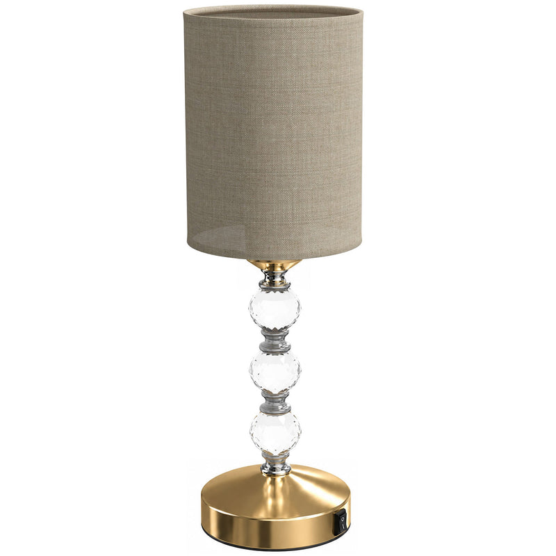 Crystal bedside lamp with a drum shade and three faceted crystal accents, studio shot