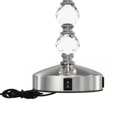 Close-up of the lamp base showing the rocker switch and lower crystal stem