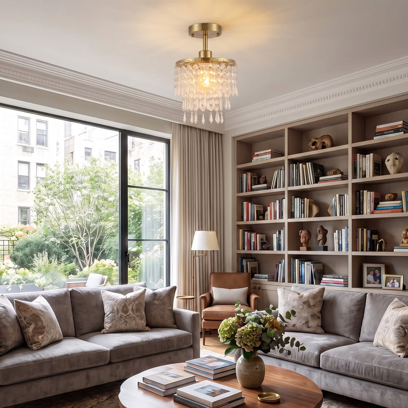 Gold Tone ceiling light above a living room bookshelf and sofa