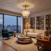 Gold Tone ceiling light illuminating an evening city apartment living room