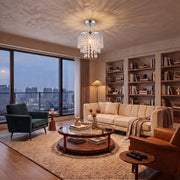 Silver Tone ceiling light illuminating an evening city apartment living room