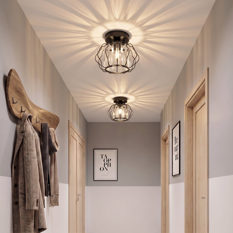 Crystal ceiling lights lighting a slim corridor with coats hanging on the wall