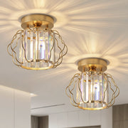 Two crystal ceiling lights switched on, casting a starburst pattern across a white ceiling