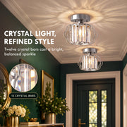 Crystal ceiling lights in a dark green entrance hall with a crystal bar inset
