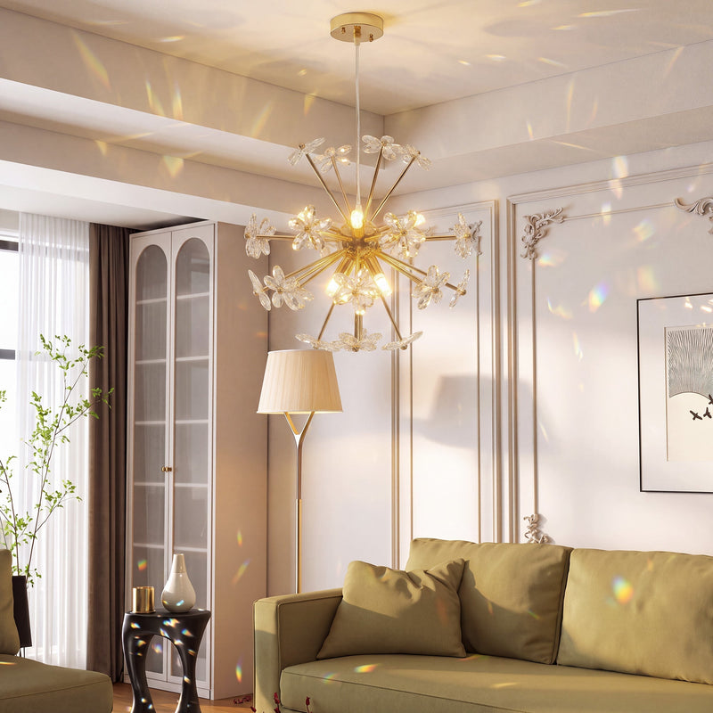 Crystal flower chandelier lit above a sofa in a living room