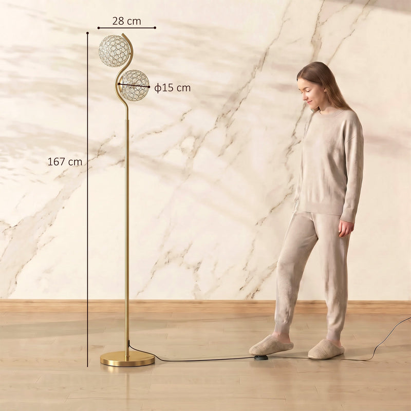 Gold crystal globe floor lamp beside a standing woman with 167 cm height, 28 cm width and 15 cm globe diameter labelled