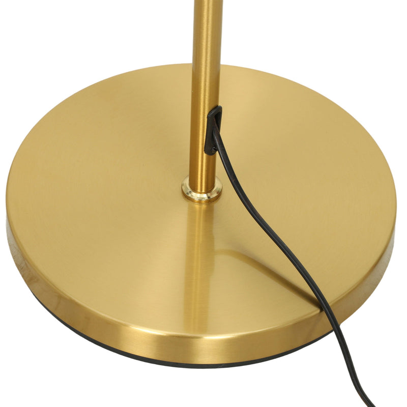 Close-up of the round gold weighted base with the power cable leaving it