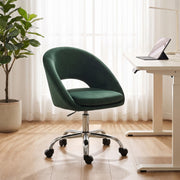 Dark green desk chair beside a height-adjustable desk with a potted plant