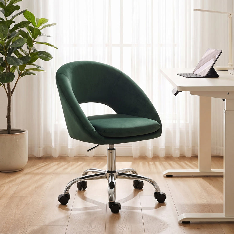 Dark green desk chair beside a height-adjustable desk with a potted plant