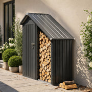 Firewood shed beside a house wall with a stack of logs and plant pots