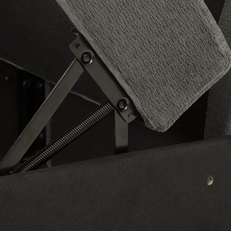 Close-up of the metal lift-up hinge and spring mechanism under a dark grey sofa seat