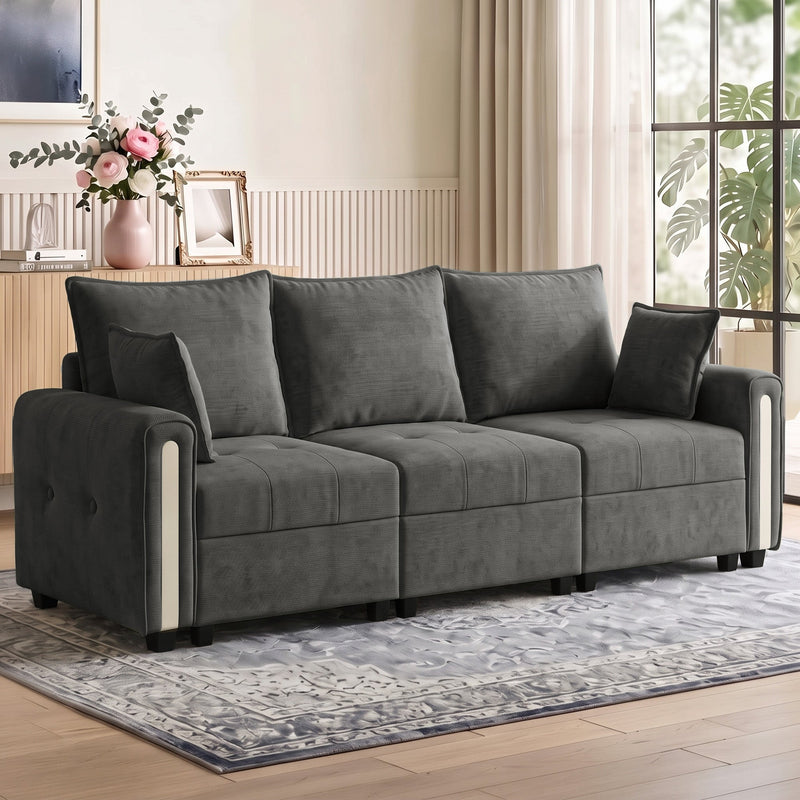 Dark grey velvet 3 seater sofa in a bright living room on a patterned rug
