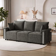 Dark grey velvet storage sofa in a living room beside a side table and round rug
