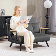Woman reading in the dark grey sofa reclined in the lounge configuration