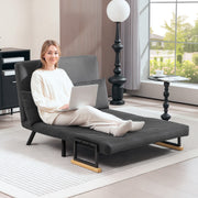 Woman using a laptop in the floor-sofa lounge configuration