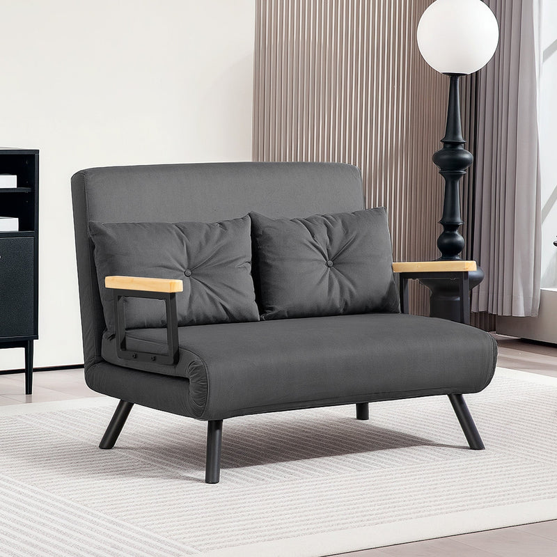 Full dark grey sofa bed shown in loveseat mode in a room setting
