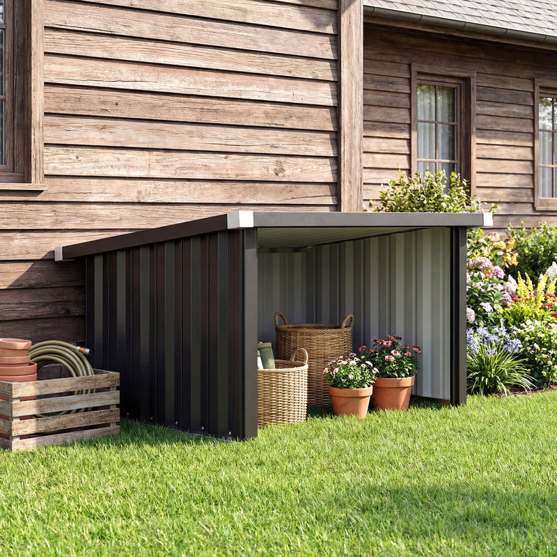 Robot mower garage on a lawn beside a house with baskets and plants