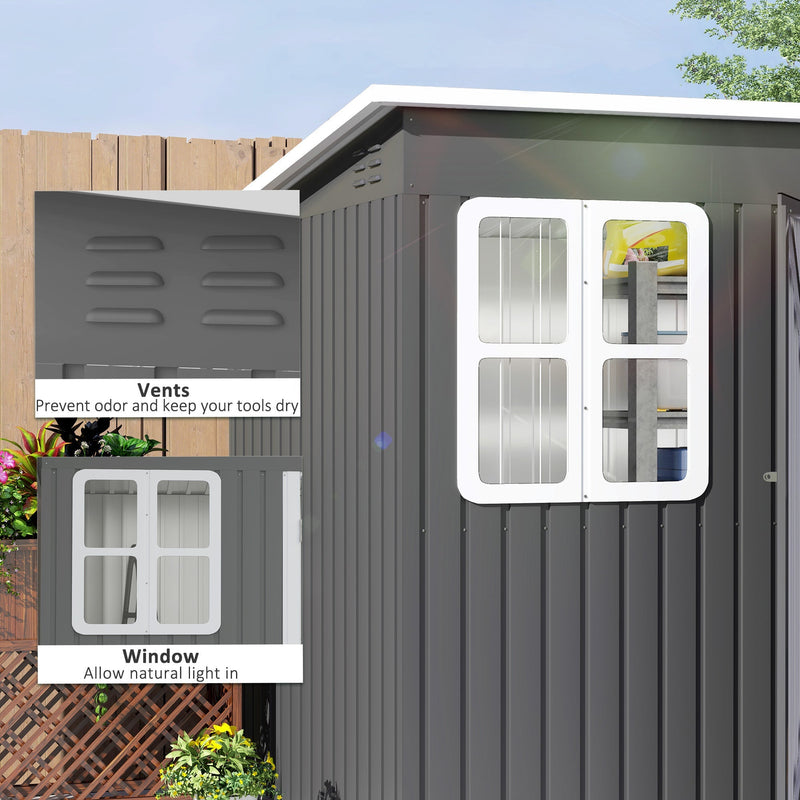 Close-up panels of the air vents near the roofline and the four-pane front window on the dark grey shed