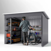 Cutaway studio view of the shed interior with a person, a bike and shelving units showing the storage space